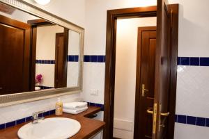 a bathroom with a sink and a mirror at Officine Bordighera in Bordighera