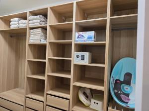 a walk in closet with wooden shelves at Random Villa in Révfülöp
