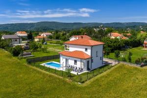 an aerial view of a house with a pool at Vila Gaspar in Dražice