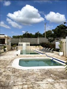 a swimming pool in the middle of a yard at Villa in Vipingo in Vipingo