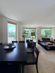 a living room with a black table and a couch at Villa Celeste -Flexrent Immobiliare Abissinia in Santa Maria di Scacciano