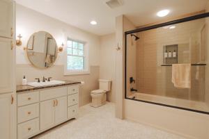 a bathroom with a shower and a sink and a toilet at Hot Tub Fire Pit Mountain Retreat Deer Meadows in Jeffersonville +38 photos