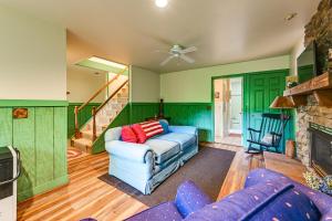 a living room with a couch and a fireplace at Unplug! Lake Toxaway Cabin w/ Dock Access in Lake Toxaway