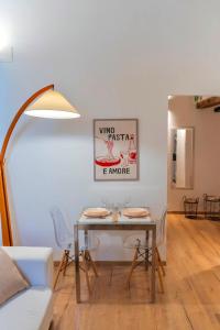 a dining room with a table and chairs at torre poesia in Trani