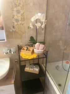 a bathroom with a shelf with a sink and a shower at Armonia edificio storico del 1563. in Cevio +50 photos