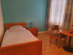 Giường trong phòng chung tại Hotel Busch in Wilster