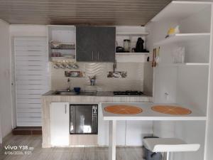 a kitchen with white cabinets and a counter top at Apartamento completo Santa Rosa de Cabal in Santa Rosa de Cabal