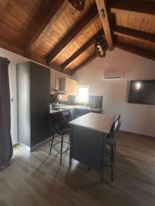 a kitchen with a table and chairs in a room at Villa Maria III in Vodice