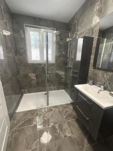 a bathroom with a shower and a sink at Villa Maria III in Vodice