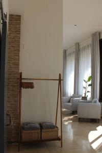 a living room with a couch and a swing at Elysium Luxury Stays in Melegis +49 photos