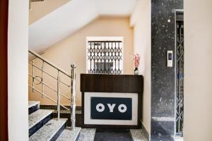 a sign on a fireplace in a building at Hotel O by OYO Eco Greenway Retreat in Salua