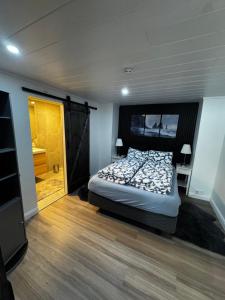 a bedroom with a bed and a television in it at Puffin rock in Vestmannaeyjar