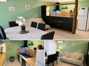 a kitchen and a living room with a table and a refrigerator at L'Arletta in Saint-Cyprien-Plage