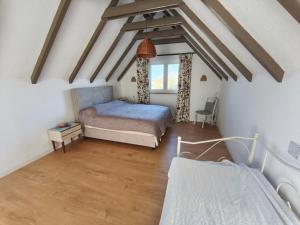 a bedroom with a bed and a window at Holiday Home Kostandinovic in Modriča