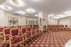 a room with a bunch of chairs in it at Sonata Hotel in Kyiv +27 photos