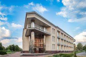 a building with a balcony on the side of it at Sonata Hotel in Kyiv