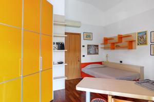 a room with a bed and a room with a desk at La Casa di Gio - 2 Camere Singole in Campanella +22 photos