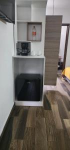 a living room with a flat screen tv on the floor at Hotel Angeles in Ciudad Serdán +9 photos