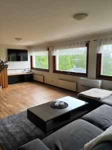 a living room with a couch and a table at Strandvillan in Älandsbro