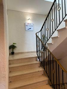 a stairway with a sign that reads main hallway at Hotel Main Taunus in Hochheim am Main