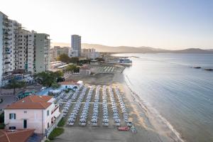 an aerial view of a beach with parked cars at Hotel Ausonia in Follonica