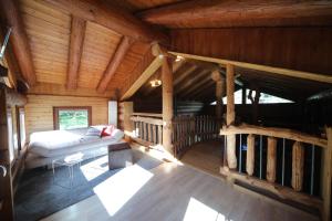 an overhead view of a living room in a log cabin at Le Gîte de Briey - Chalet complet in Chalais