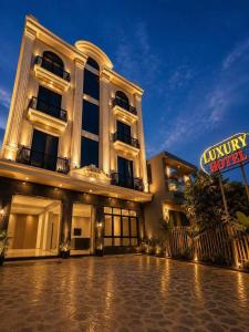 a building with a sign in front of it at Luxury Hotel Long Thành in Xóm Nước Trong