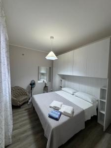 a bedroom with a bed with a blue tray on it at Casa C&S in Mascali