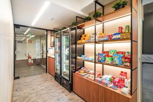 a grocery store aisle with shelves of food at Fast Sleep Guarulhos by Slaviero Hotéis in Guarulhos
