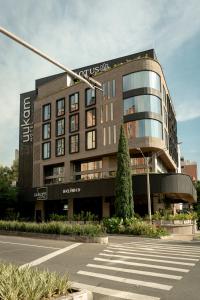 a building with a crosswalk in front of it at Uukam by Bernalo Hotels in Medellín