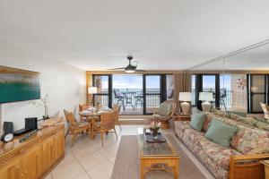 a living room with a couch and a table at Kaleialoha 211 · KA 211 OceanFront 1BD Whale Watch Relax Getaway in Kahana