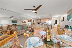 a living room with a couch and a table at Kaleialoha 211 · KA 211 OceanFront 1BD Whale Watch Relax Getaway in Kahana