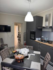 a kitchen with a table with a bowl of food on it at Casa C&S in Mascali