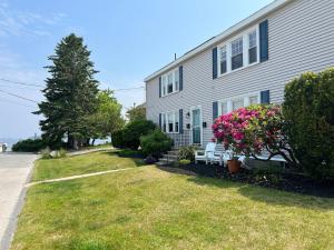 a house with a bench in front of it at Inn on Willard in South Portland