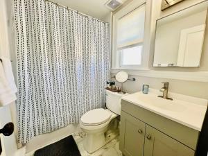 a bathroom with a toilet and a sink and a shower at Inn on Willard in South Portland +41 photos