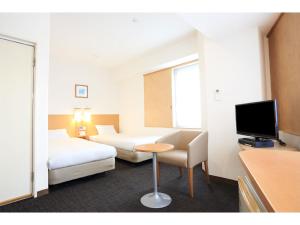 TV a/nebo společenská místnost v ubytování Smile Hotel Shiogama