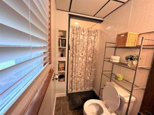 a bathroom with a toilet and a shower at Ahmeek-5 in Dover +13 photos