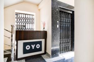 an entrance to a building with an open door at Hotel O by OYO Eco Greenway Retreat in Salua