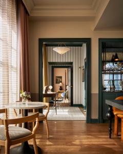 a living room with a table and chairs at Cincinnati's Fidelity Hotel in Cincinnati +188 photos