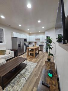 a living room with a couch and a table at Nest in the City in Fort Mill