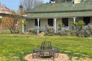 a bird bath in the yard of a house at Oscar's Place in Yass