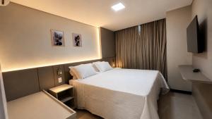 Llit o llits en una habitació de MR Hotel