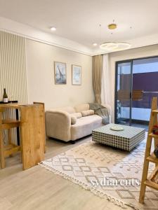 a living room with a couch and a table at Leo Residency in Nairobi