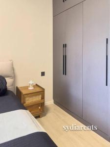 a bedroom with a bed and a sliding door at Leo Residency in Nairobi