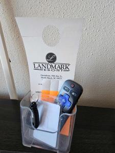 a plastic container with a remote control and a box at Oceanview Room at Landmark Resort in Myrtle Beach