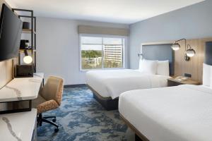 a hotel room with two beds and a desk at Fairfield Inn & Suites by Marriott Atlanta Vinings/Galleria in Atlanta +27 photos