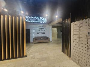 a room with a couch in a room with drawers at NATALIA - Building Stefan Resort II in Năvodari