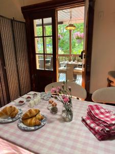 a table with two plates of pastries on it at Au Coeur De Magog in Magog-Orford