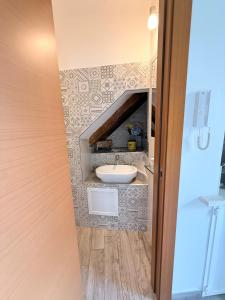 a bathroom with a sink in a room at Vacanze d'amore in Cefalù