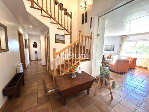 a room with a staircase and a living room at Casa Torrebosca 43 in Platja d'Aro